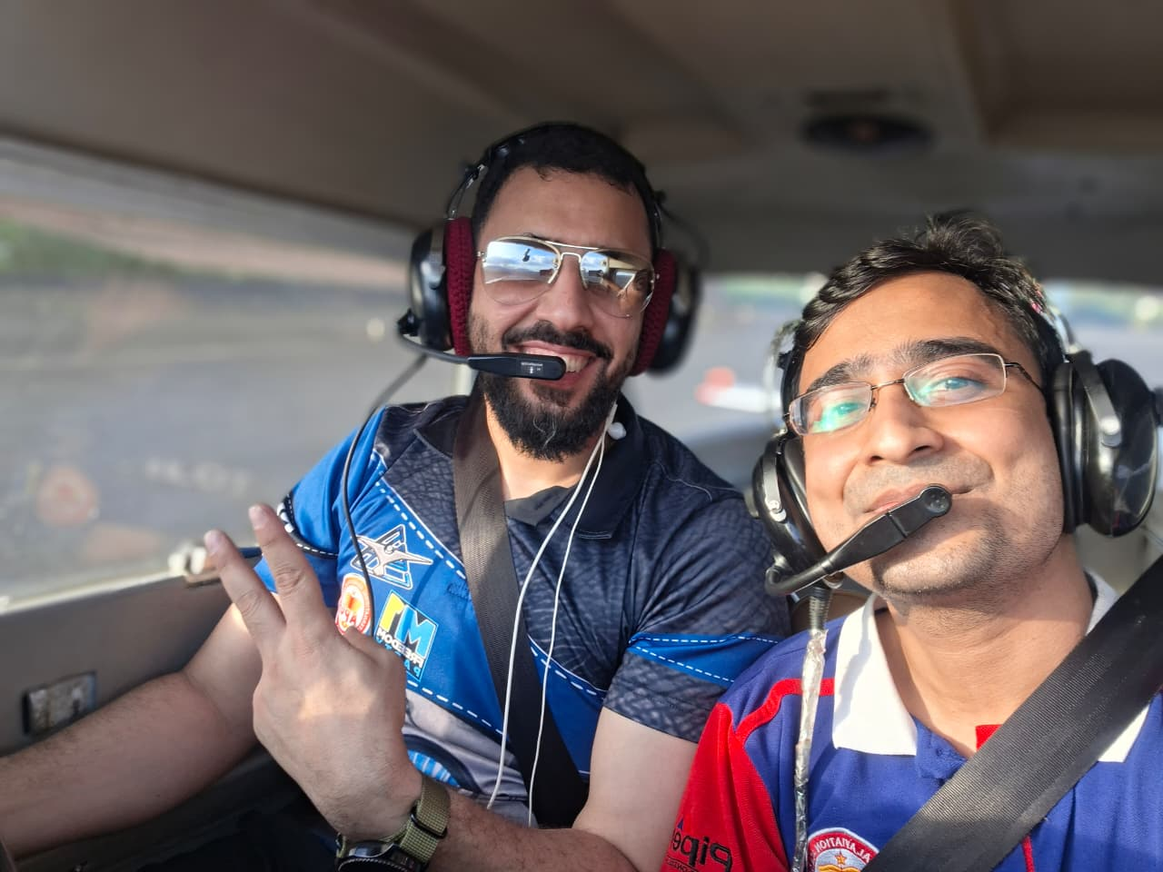 Students taking a selfie in the cockpit during training
